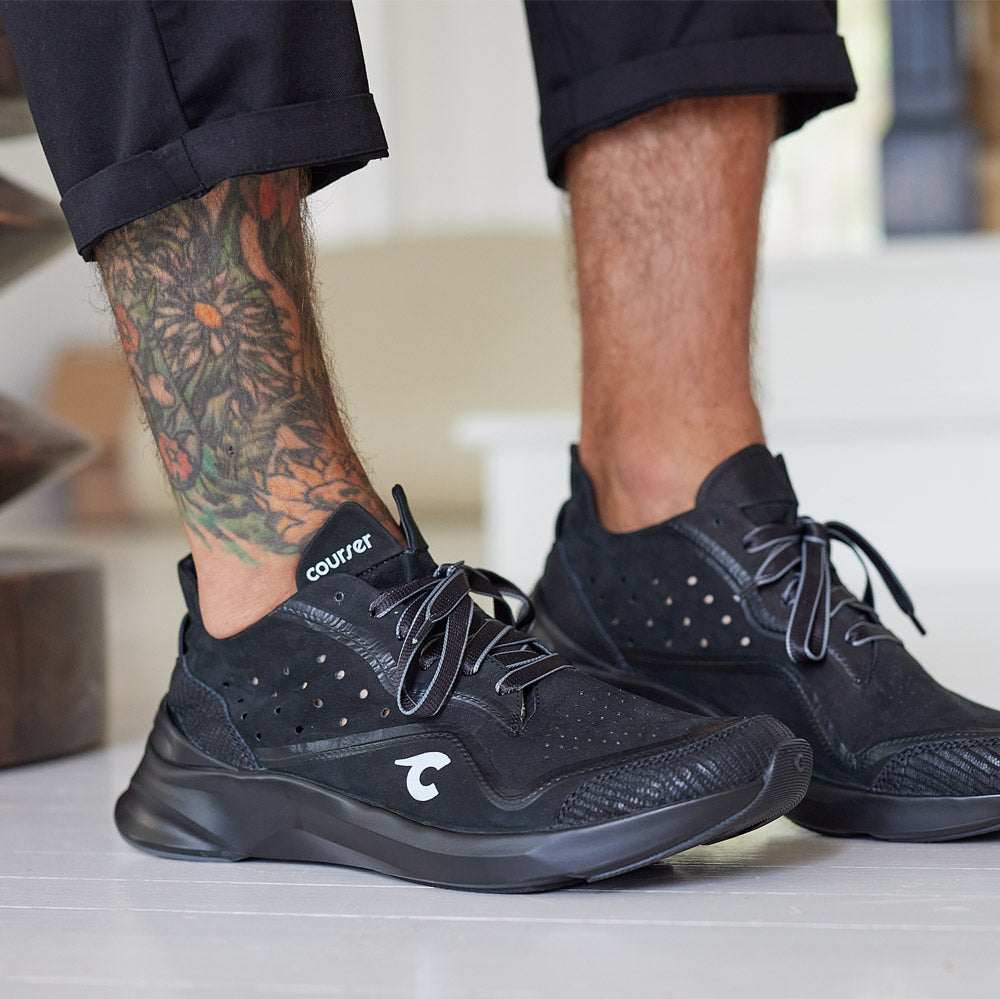 Man wearing Courser Uno Men's Black Mono Italian-Made Luxury Sneakers