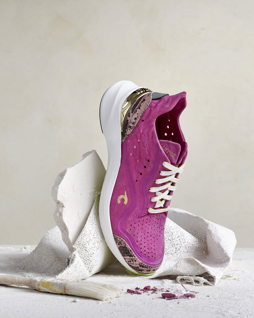 Pink Courser luxury sneakers standing on toe