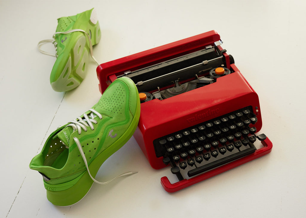 Courser Uno sneakers in Acid Green near red typewriter